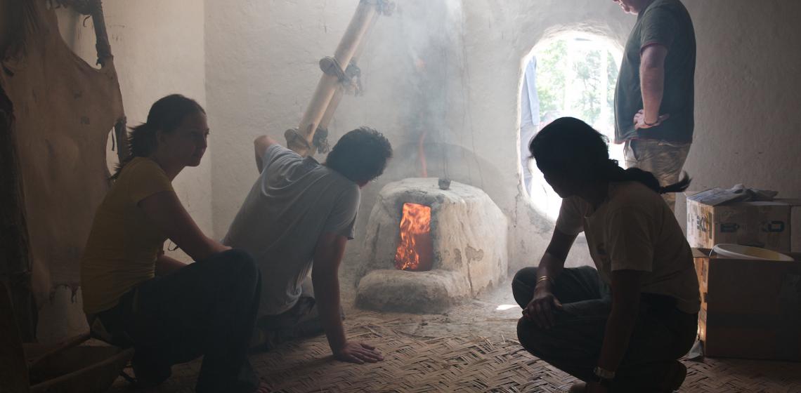 Photo: Experimental firing of an oven inside a reconstructed building (Photo: Jason Quinlan)