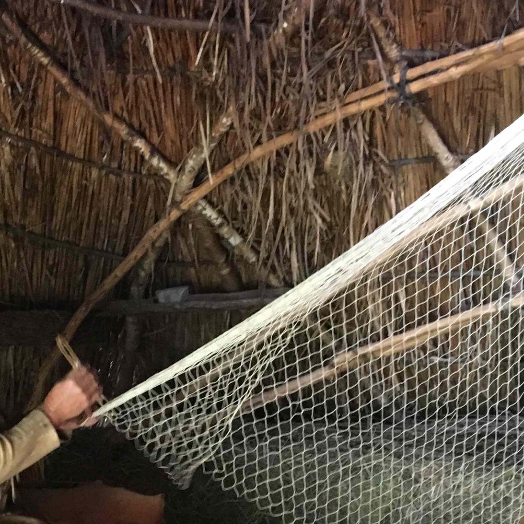 Weaving a fishernet in the Stone Age Park Dithmarschen (DE)